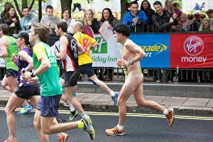 Jogging Prints: Man dressed in a black wig and mankini running the London Marathon 2015