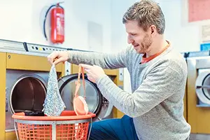 Laundromat Prints: Man finds strange women's underwear in laundry basket in laundromat