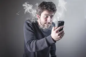 Trouble Prints: Man furious with his phone smoking with rage