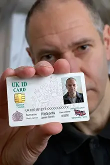 Citizenship Prints: Man holding United Kingdom Identity card Mock up