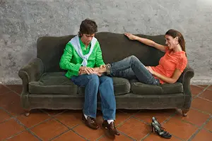 Heterosexual Prints: Man massaging girlfriend's feet
