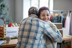 Young Girl Prints: Man in plaid shirt hugging young smiling girl