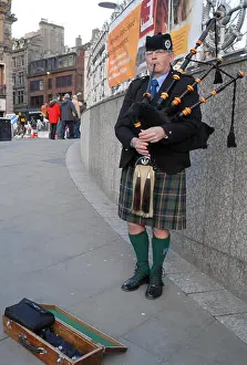 Tartan Prints: Man playing bagpipes in Edinburgh, Scotland