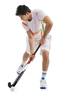 20 25 Prints: Man playing field hockey isolated over white background
