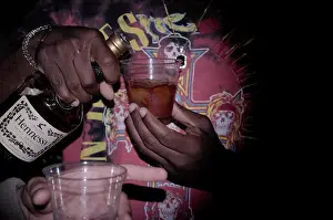 Mixing Prints: man pouring himself a drink