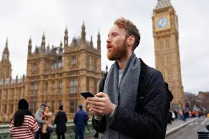 Concentrating Prints: Man with a smartphone in his hands on the streets of London