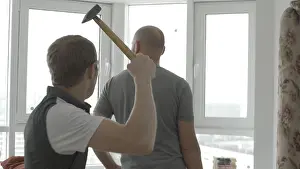 Tint Prints: Man sneaks up behind to hit with a hammer. Swings a hammer to hit