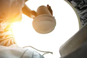 Throw Prints: Man throws a disposable coffee cup into trash