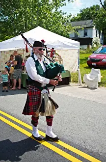Entertainer Prints: Man in traditional Kilt playing a bagpipe at the annual Occoquan Craft Fair