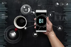 Char Prints: Man using digital device with BI word and fintech infographic icon on virtual screen