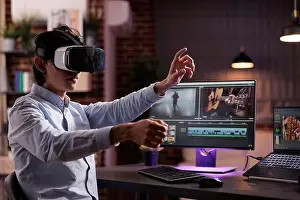 Reality Prints: Man using vr glasses to edit film footage with computer software app