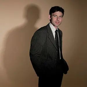 Poses Prints: Man wearing suit with his hands in his pockets
