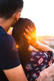 Female Friend Prints: Man and Woman. Young and happy asian couple hugging each other