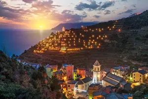 Ligurian Prints: Manarola, Italy in the Cinque Terre Region during Christmas season with illumination at dusk