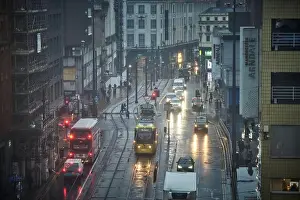 Transporter Prints: Manchester city center on a cold wet raining dark winter morning along High Street
