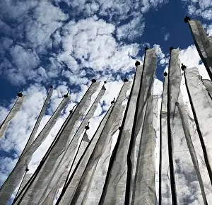 Consoling Prints: Manidhar Prayer Flags; white prayer flags in groups of 108 hoisted in remembrance of the dead