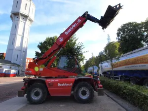Projects Prints: The Manitou MRT 2150 is a telescopic forklift designed for heavy-duty lifting and material handling