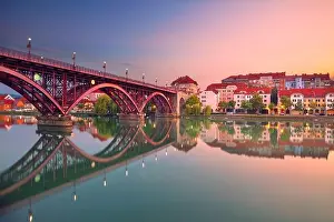 Maribor, Slovenia. Cityscape image of Maribor, Slovenia at beautiful summer sunrise with reflection of the city in Drava River