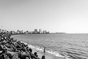 Marine Drive with locals and travellers enjoying the sun bathing at the Chowpatty beach