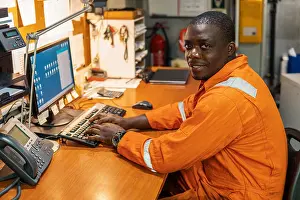 Occupied Prints: Marine engineer officer working in engine room