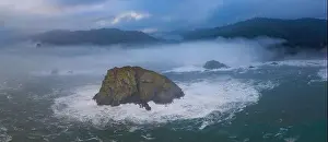 The marine layer drifts over the coastline of Northern California in Klamath. This region is home to the world's most beautiful temperate forests