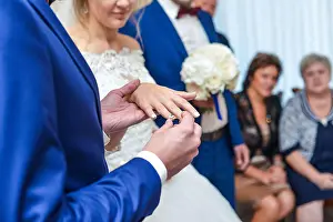 Veil Prints: marriage hands with rings. birde wears the ring on the finger of the groom