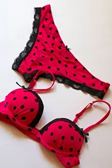 Knickers Prints: matching sexy polka dot pink coloured with black lace edged underwear set - bra and knickers set on white background