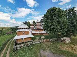 Rural Area Prints: Matkiv, Ukraine - July 21, 2021: Aerial view on ancient wooden Church of Synaxis of the Holy Mother of God in Matkiv