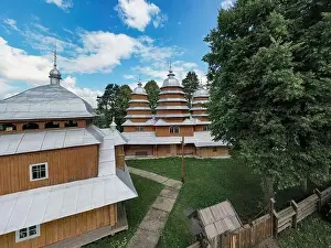 Carpathian Prints: Matkiv, Ukraine - July 21, 2021: Aerial view on ancient wooden Church of Synaxis of the Holy Mother of God in Matkiv