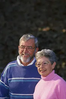 Citizens Prints: Mature couple in woods with fall foilage