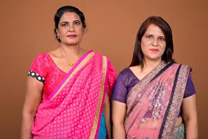 Tied Prints: Two mature Indian women wearing Sari Indian traditional clothes