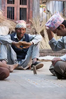 Bhaktapur Prints: Mature men playing a game in Bhaktapur - Bhaktapur, Kathmandu Valley, Nepal