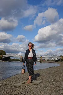 Skirt Prints: Mature middle aged woman in Autumn fashion clothes by the River Thames at Barnes Mortlake London UK