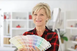 Renovating Prints: mature woman holding a color swatch