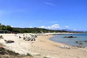 Arbatax Prints: May 23 2023 - Arbatax, Sardinia in Italy: people at the hakuna matata beach with white sand and crystal clear water