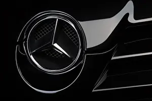 Grille Prints: McLaren SLR in black, classical detail shot of the logo badge on the front grille