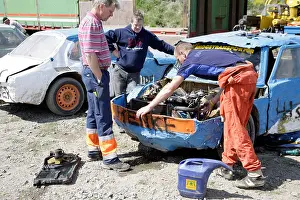 Repairing Prints: Mechanic tuning car engine for the Folkrace a kind of banger racing in Torslanda Racecourse Gothenburg Sweden