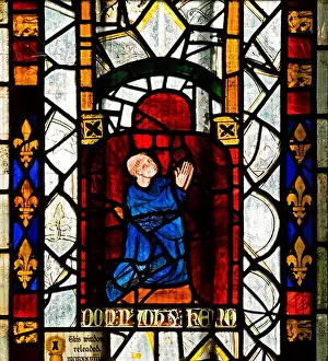 Kneeling Prints: Medieval stained glass depicting a male kneeling in prayer