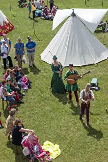 British English Prints: Medieval tournament re-enactment three musicians playing lute and bagpipes