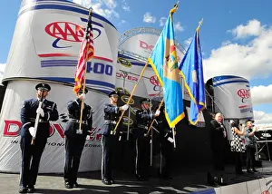 Members of the Team Dover honor guard present the colors during the national anthem before the start of the AAA 400