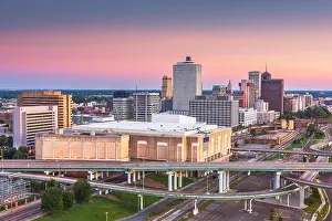 Memphis, Tennessee, USA downtown city skyline over highways at dusk