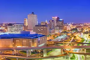 Memphis, Tennessee, USA downtown city skyline over highways at dusk
