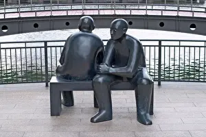 Canary Prints: Two Men on a Bench statue (1990) by Giles Penny, Cabot Square, Docklands, London, UK