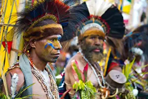 Papua New Guinea Prints: Men dressed in traditional tribal outfits and wearing feather and animal skin headresses