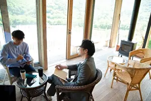 Business Person Prints: Men Having a Meeting in Unique Venue