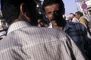 Meet Prints: two men meet on the street baghdad iraq