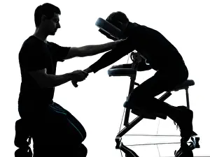 Backlit Prints: two men performing chair back massage in silhouette studio on white background