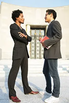 Asians Prints: Two men standing face to face talking