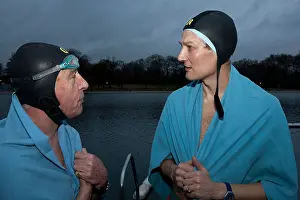 Towels Prints: Two men in swimming caps and blue towels by the serpentine lake