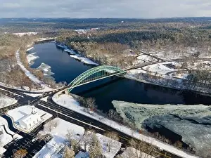 Merrimack River and Tyngsborough Bridge aerial view in winter in town center of Tyngsborough, Massachusetts MA, USA
